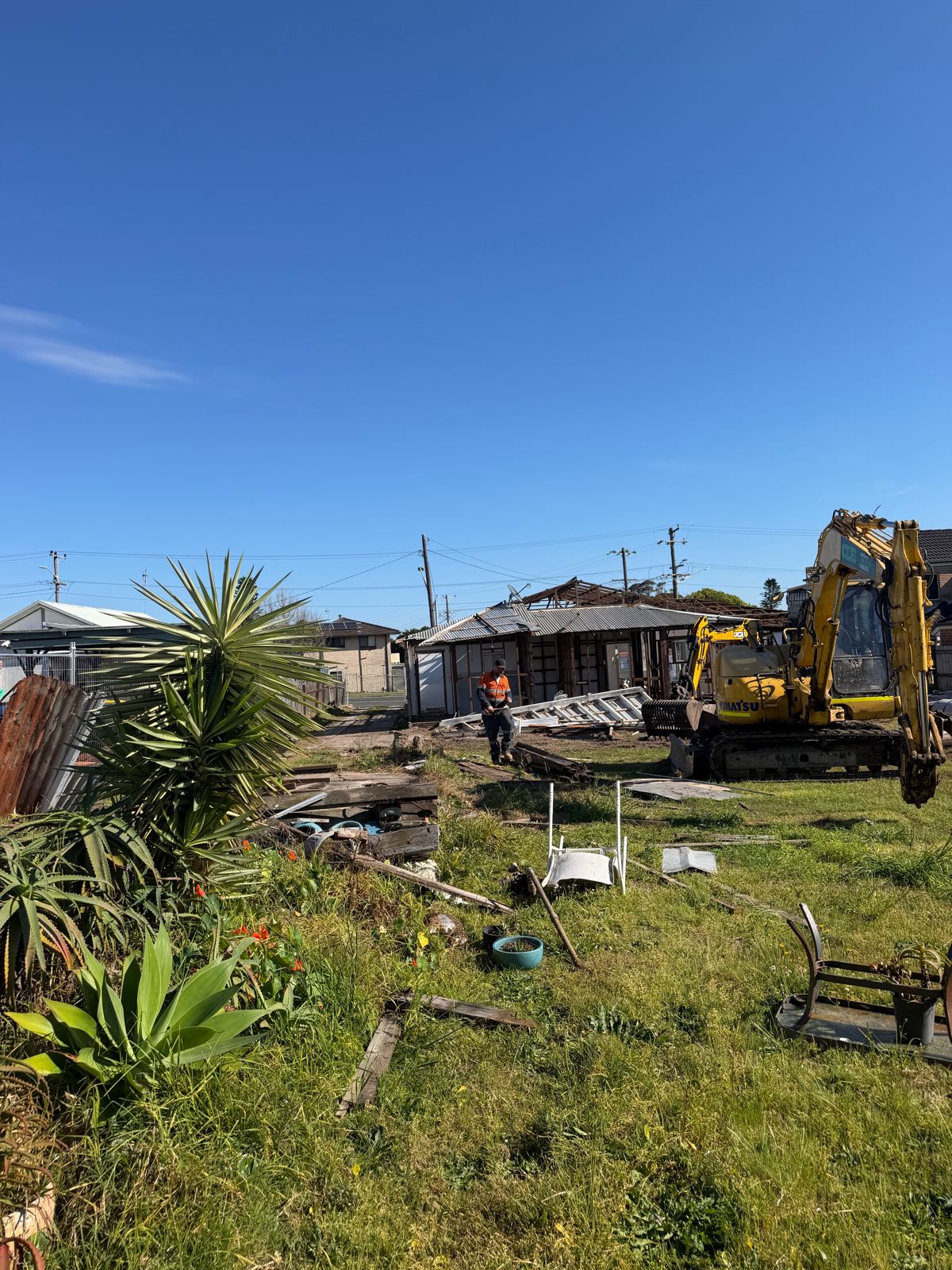 Excavator demolishing a house on the Central Coast